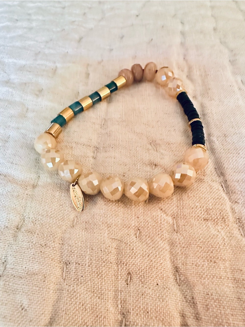Faceted Cream Bead Stretch Bracelet with Gold and Teal Accents